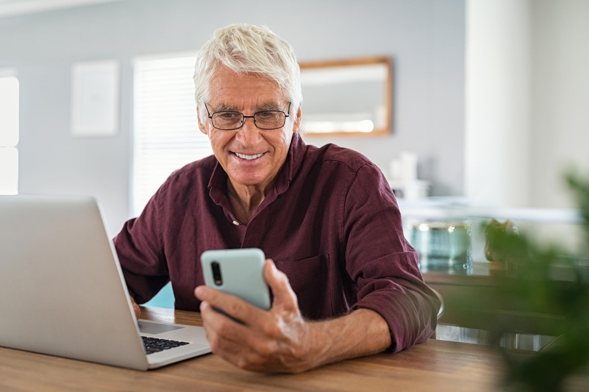 Mature-man-using-smartphone-in